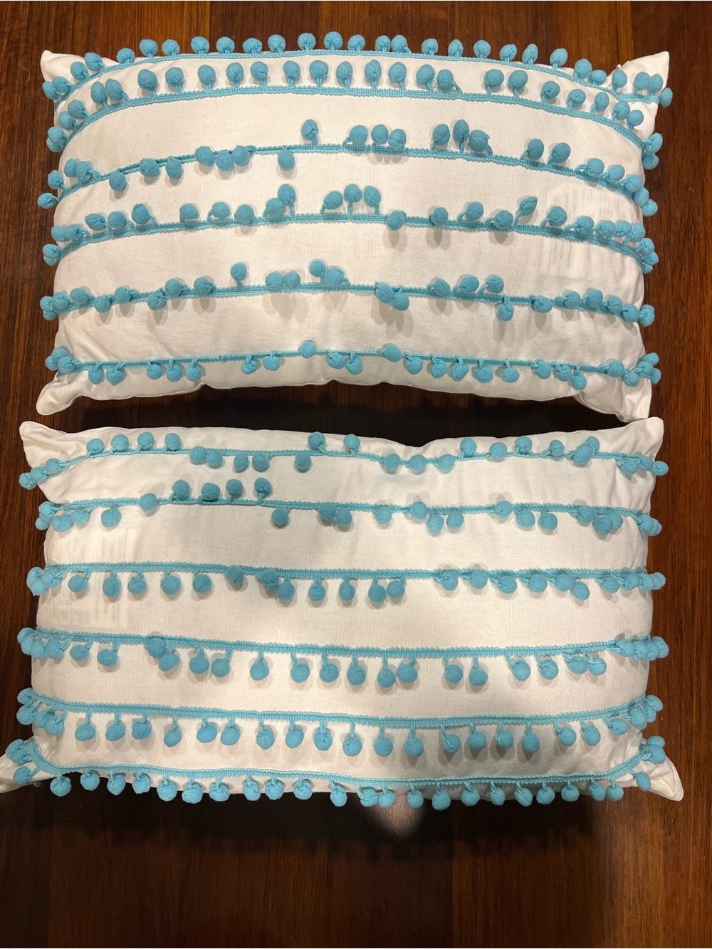 Set of 2 White Pillows with Light Blue Pom Pom Trim